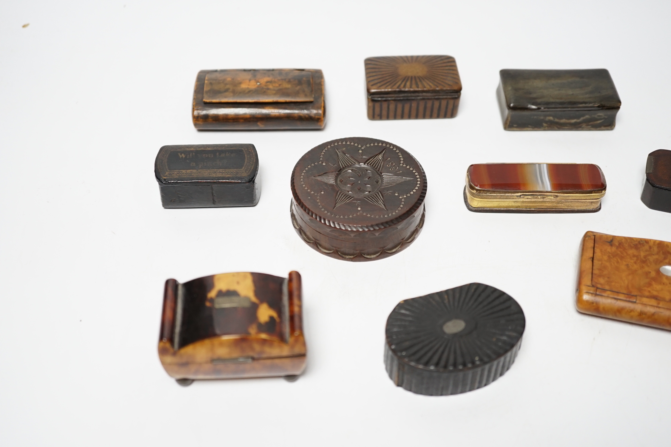 A collection of ten snuff boxes in tortoiseshell, treen or horn, etc.